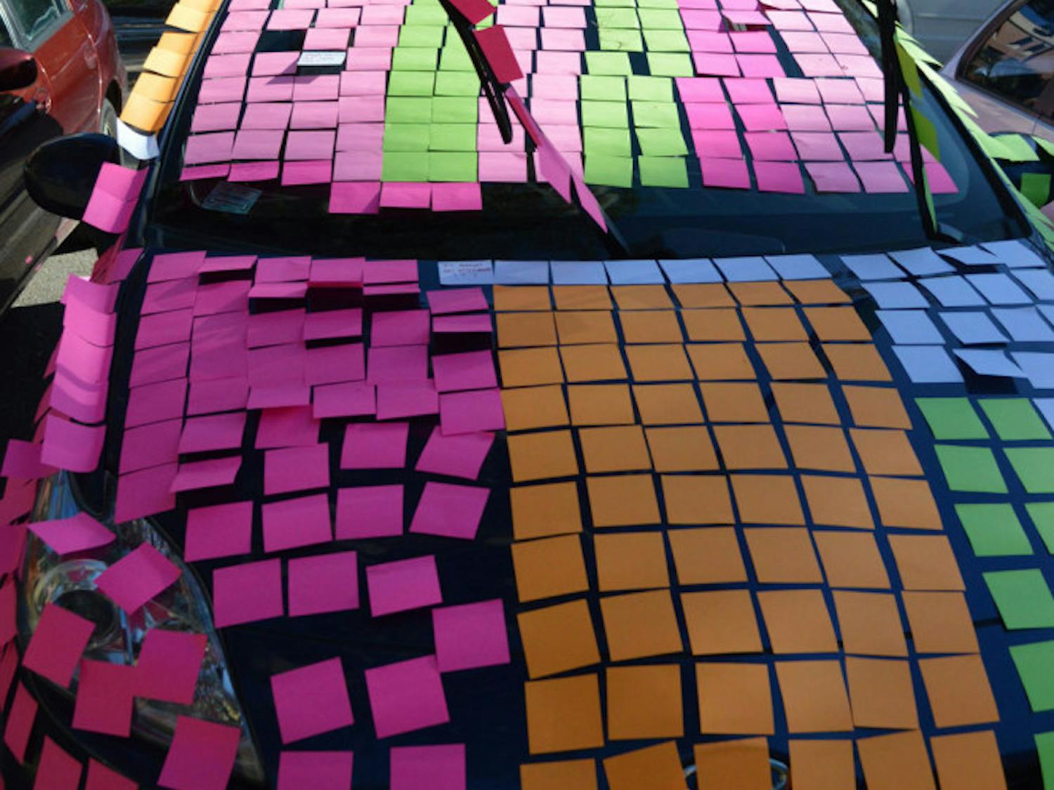 A car outside the Student Health Care Center was covered in sticky notes by UF Honors students as part of a prank on their adviser. They wrote jokes on sticky notes about the experience of being a freshman in the Honors program.