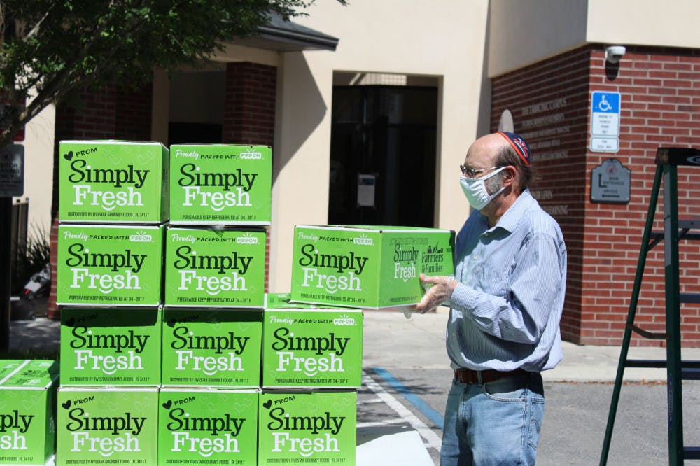 Steven Slutsky, a University of Florida professor of economics, volunteered as part of the effort to distribute boxes of food. Slutsky has volunteered at other initiatives the Lubavitch Chabad Jewish Center of Gainesville has undertaken, like when they gave away 50,000 masks.