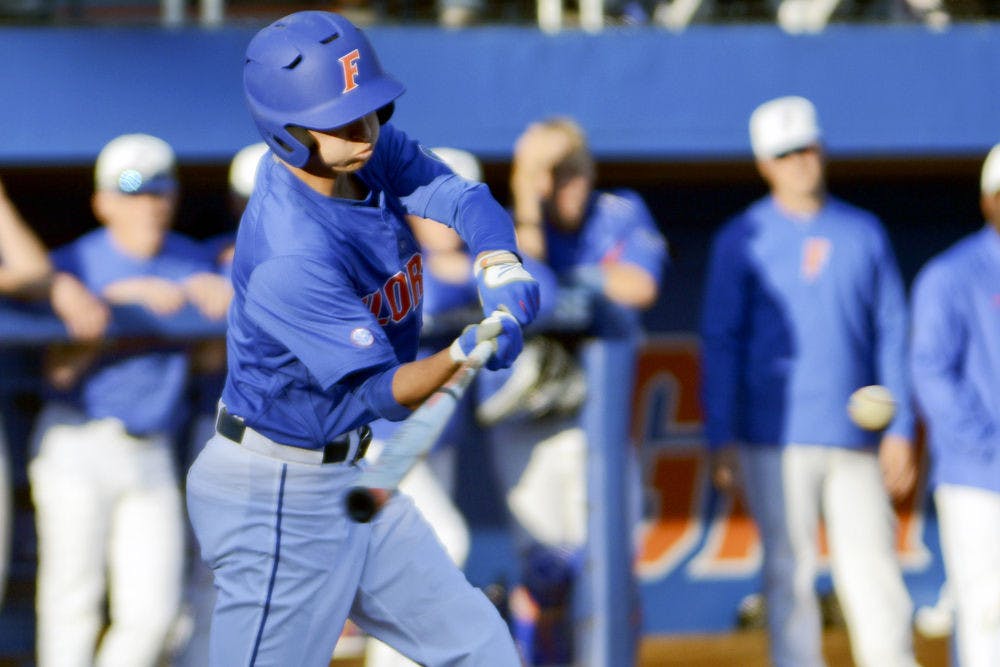 Dalton Guthrie bats during Florida's 22-3 win against Rhode Island on Saturday at McKethan Stadium.