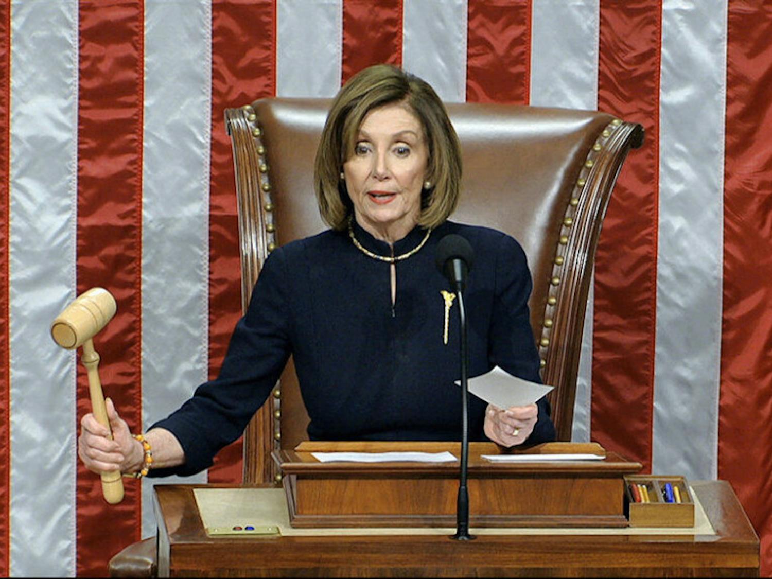 House Speaker Nancy Pelosi of Calif., announces the passage of the first article of impeachment, abuse of power, against President Donald Trump by the House of Representatives at the Capitol in Washington, Wednesday, Dec. 18, 2019. (House Television via AP)