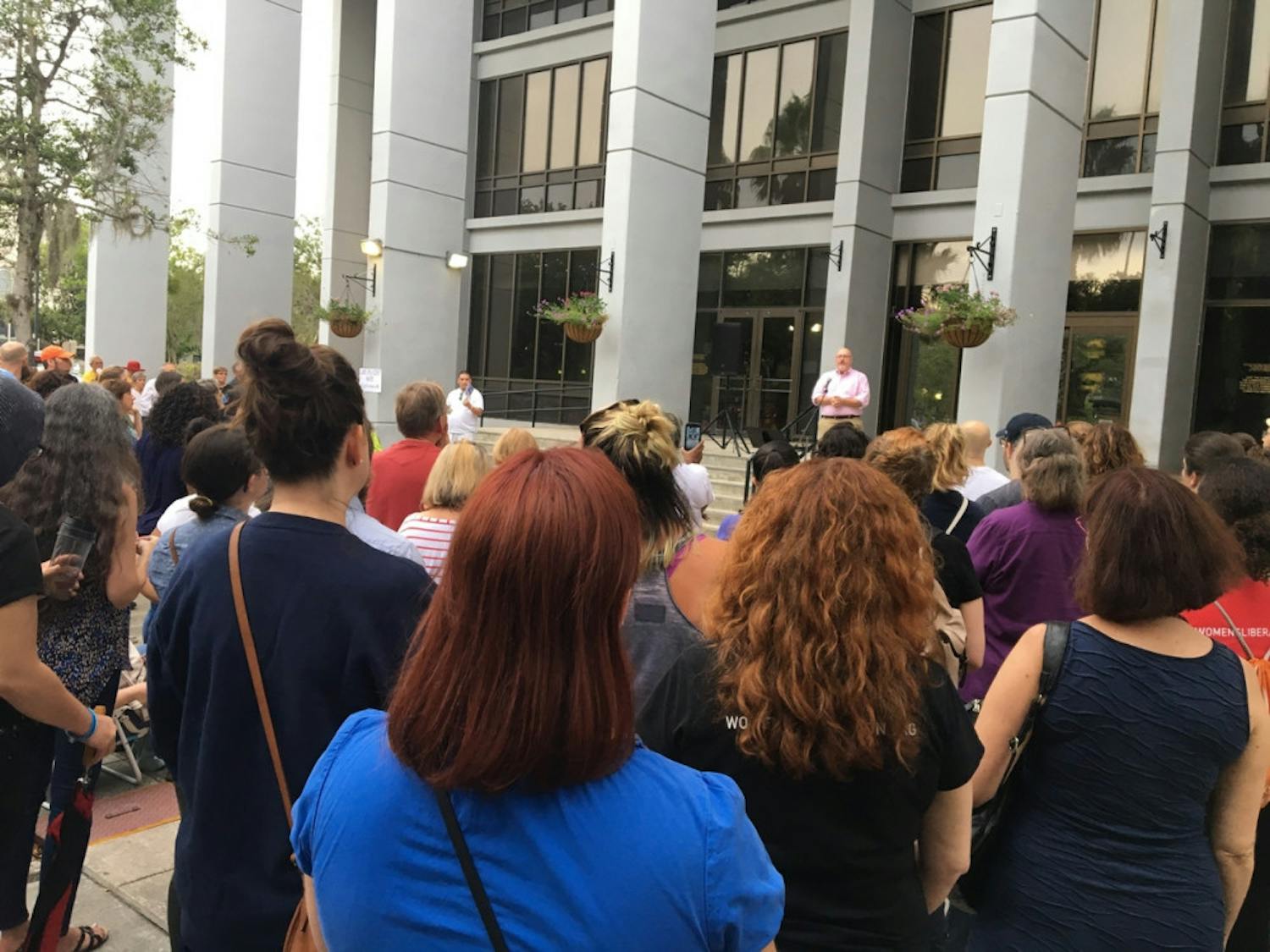 More than 300 people gather outside Gainesville City Hall to listen to Commissioner Harvey Ward Jr. speak about the Charlottesville, Virginia white supremacy rally and encourage people to get involved with their community.