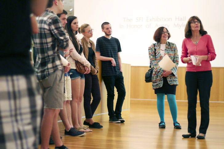 Professor Maureen Turim, second from the right, speaks to her film montage class at the Samuel P. Harn Museum of Art on Wednesday morning, comparing the artwork on display to films the group viewed in class.