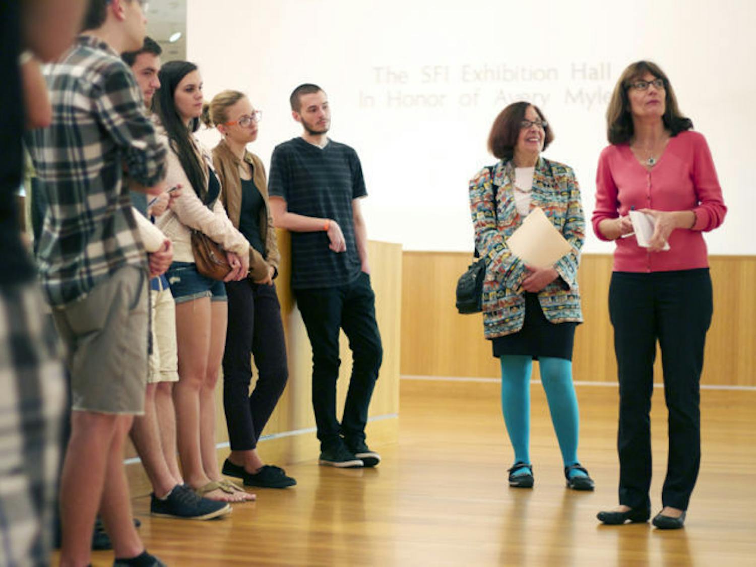 Professor Maureen Turim, second from the right, speaks to her film montage class at the Samuel P. Harn Museum of Art on Wednesday morning, comparing the artwork on display to films the group viewed in class.