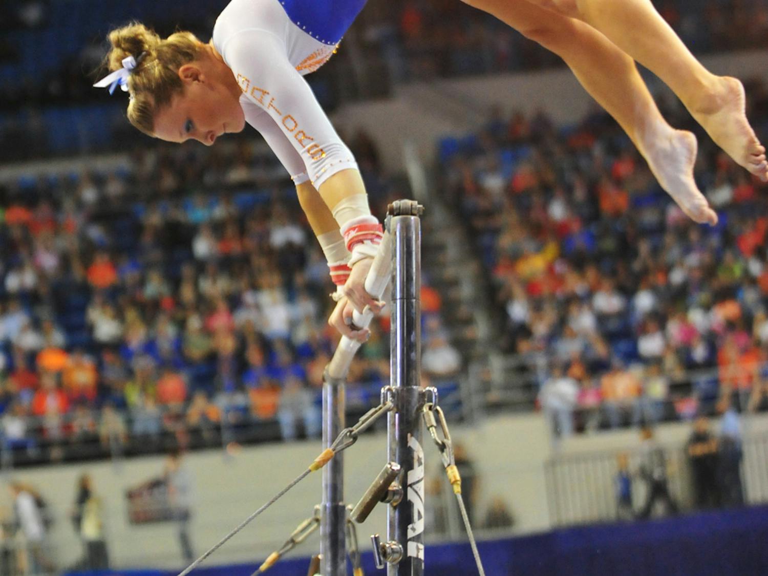 Freshman Bridget Sloan performs her bar routine during Florida's 198.10-196.85 win against Alabama on Feb. 8 in the O'Connell Center. Sloan won the all-around title at the SEC Championship meet on Saturday.