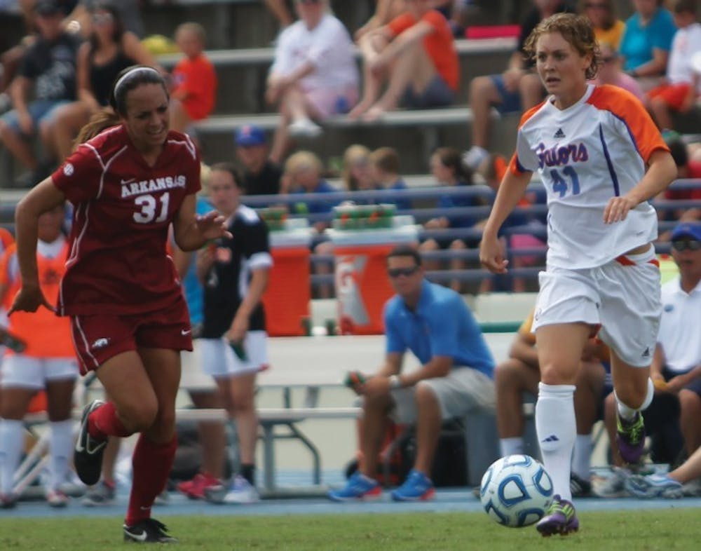 <p>Junior forward Taylor Travis (41) pushes the ball during Florida’s 4-0 win against Arkansas on Sept. 30, 2012, at James G. Pressly Stadium.&nbsp;</p>