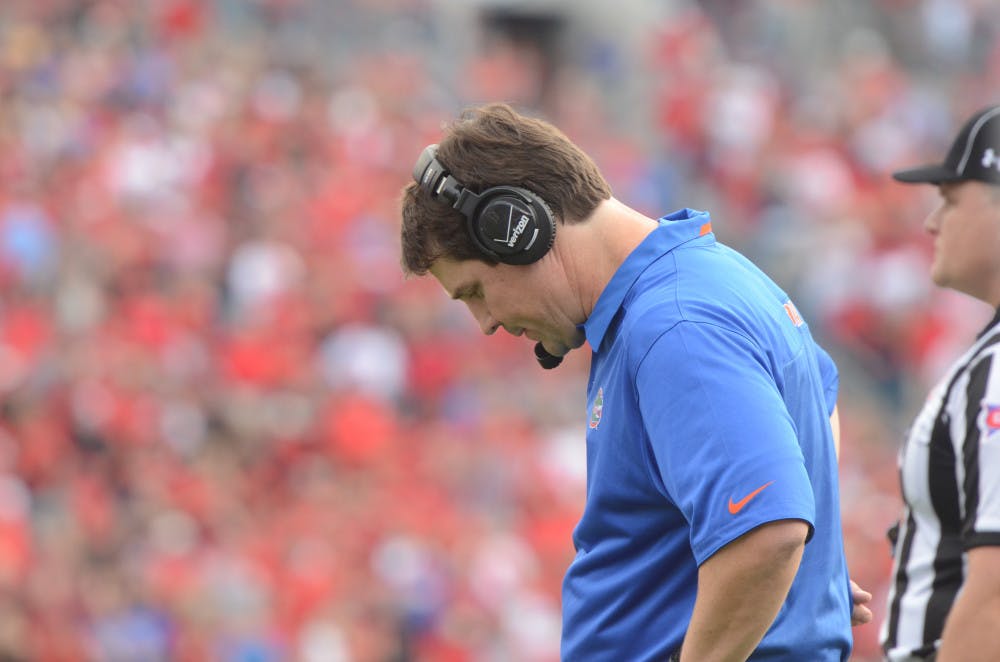 <p class="p1">UF coach Will Muschamp looks down at the field during Florida's 23-20 loss Georgia on Nov. 2 in Jacksonville.</p>