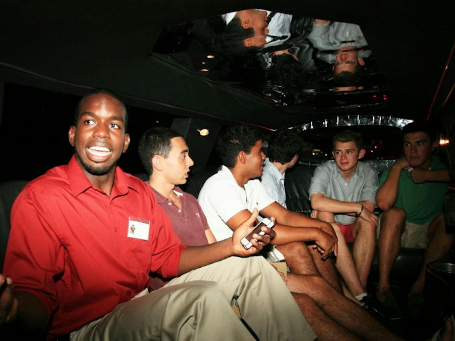 Dimittri Delevry, a 20-year-old political science junior and Theta Chi brother, rides in a limousine with potential new members of the fraternity.