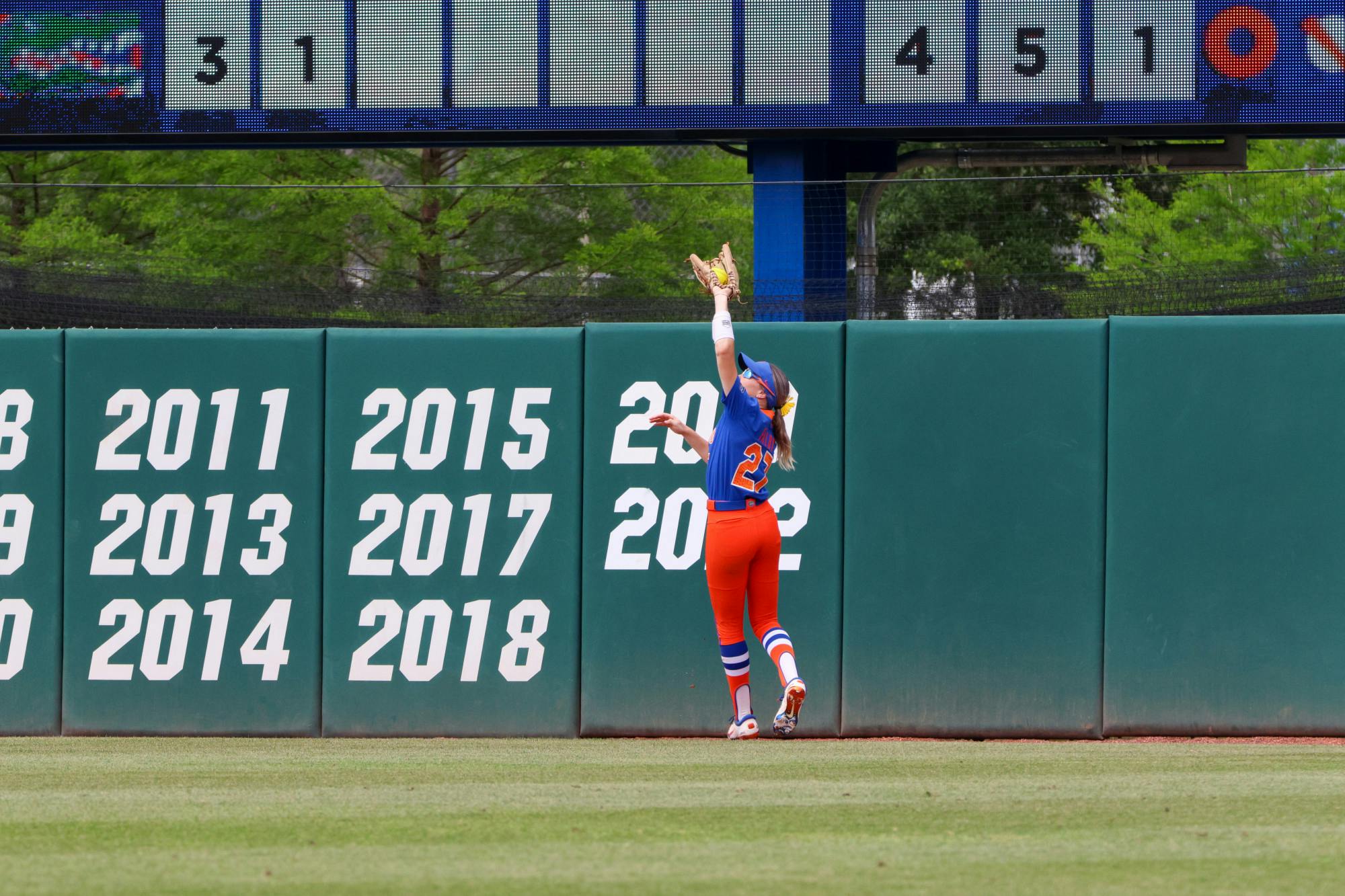 Florida outfielder Kendra Falby jumps and catches a ball in the outfield in the Gators' 8-7 win against the Georgia Bulldogs Saturday, April 15, 2023. 