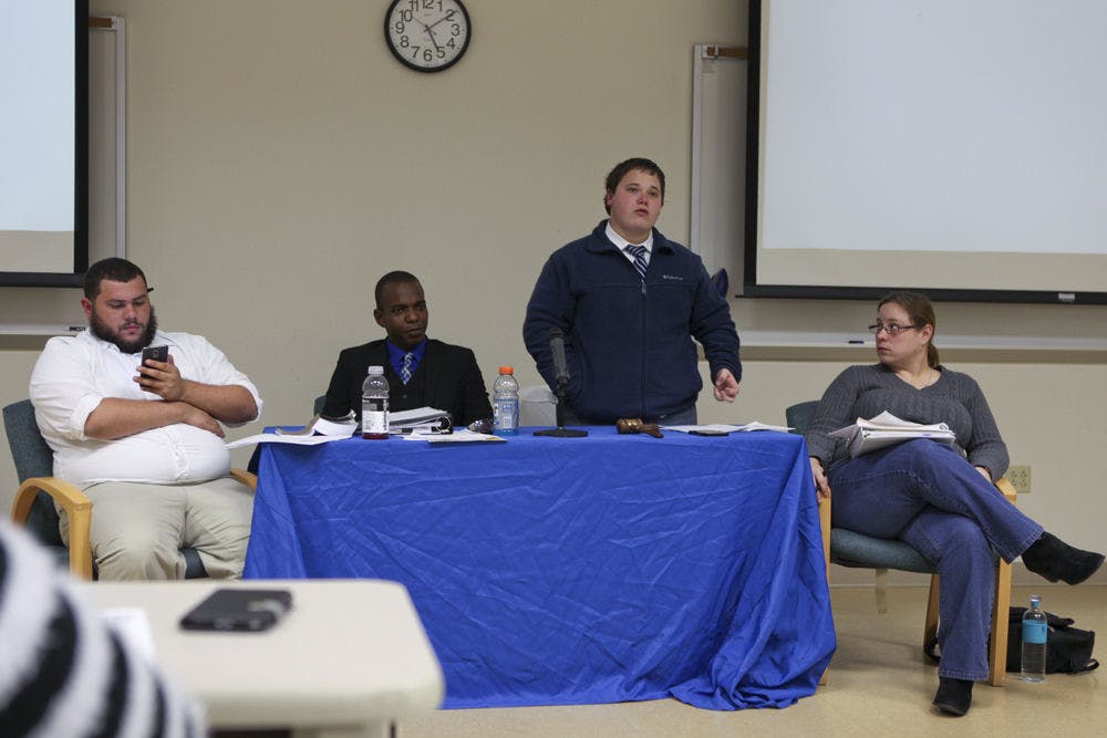 From left, SFC SG parliamentarian Andy Alvarez, Student Senate President Jeremy Pierce, Senate Pro Tempore Dalton King and Senate Secretary Kelly Cooper preside over Pierce’s impeachment along with other issues, at the SFC Student Senate meeting Wednesday.