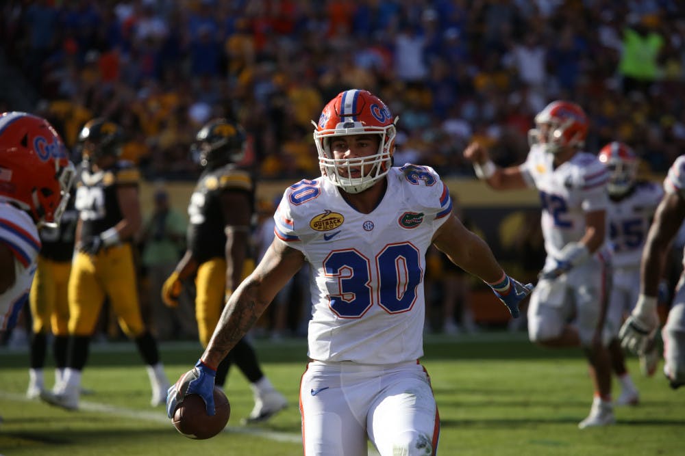 DeAndre Goolsby runs out of bounds after catching a pass during UF's 30-3 win against Iowa at the Outback Bowl on Jan. 2, 2017, at Raymond James Stadium.