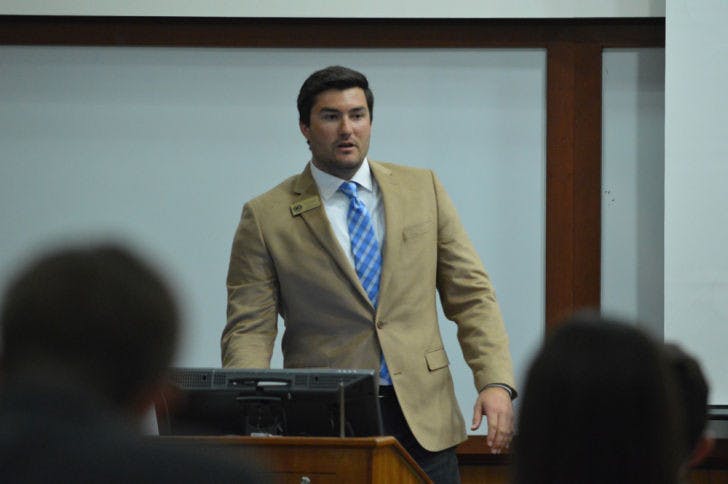 Sen. Davis Bean, chairman of the budget and appropriations committee, discusses the 2014-2015 Student Government funded organizational budget during Tuesday’s Student Senate meeting.