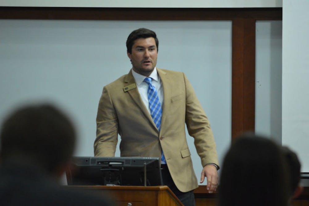 <p class="p1">Sen. Davis Bean, chairman of the budget and appropriations committee, discusses the 2014-2015 Student Government funded organizational budget during Tuesday’s Student Senate meeting.</p>