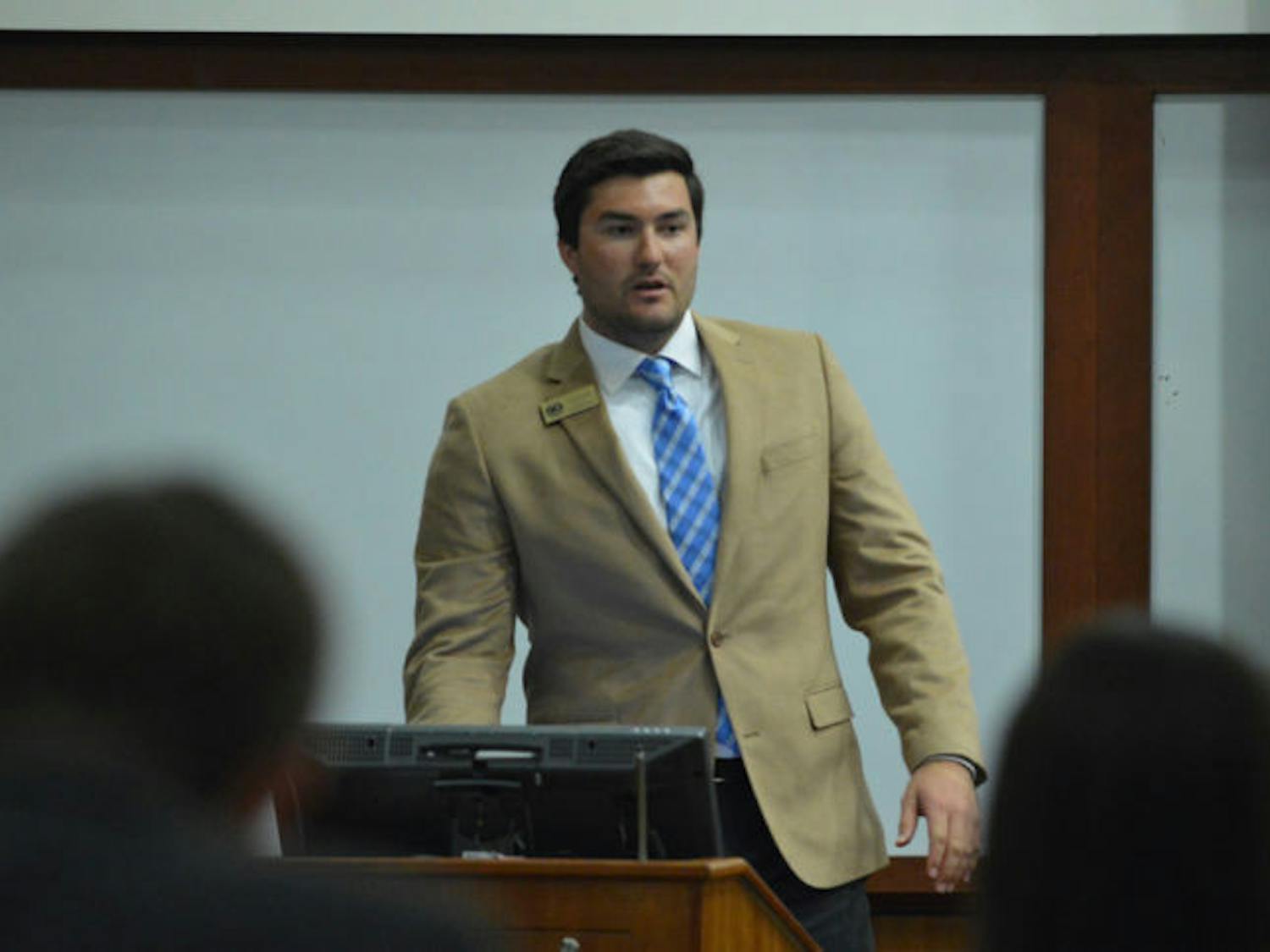 Sen. Davis Bean, chairman of the budget and appropriations committee, discusses the 2014-2015 Student Government funded organizational budget during Tuesday’s Student Senate meeting.
