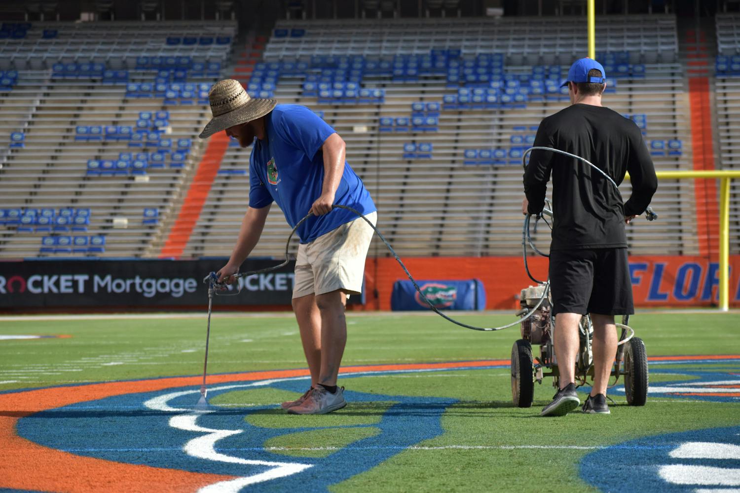Field maintenance staff add the final touches to the Steve Spurrier-Florida Field in preparation for game day on Friday, Sept. 3, 2021.