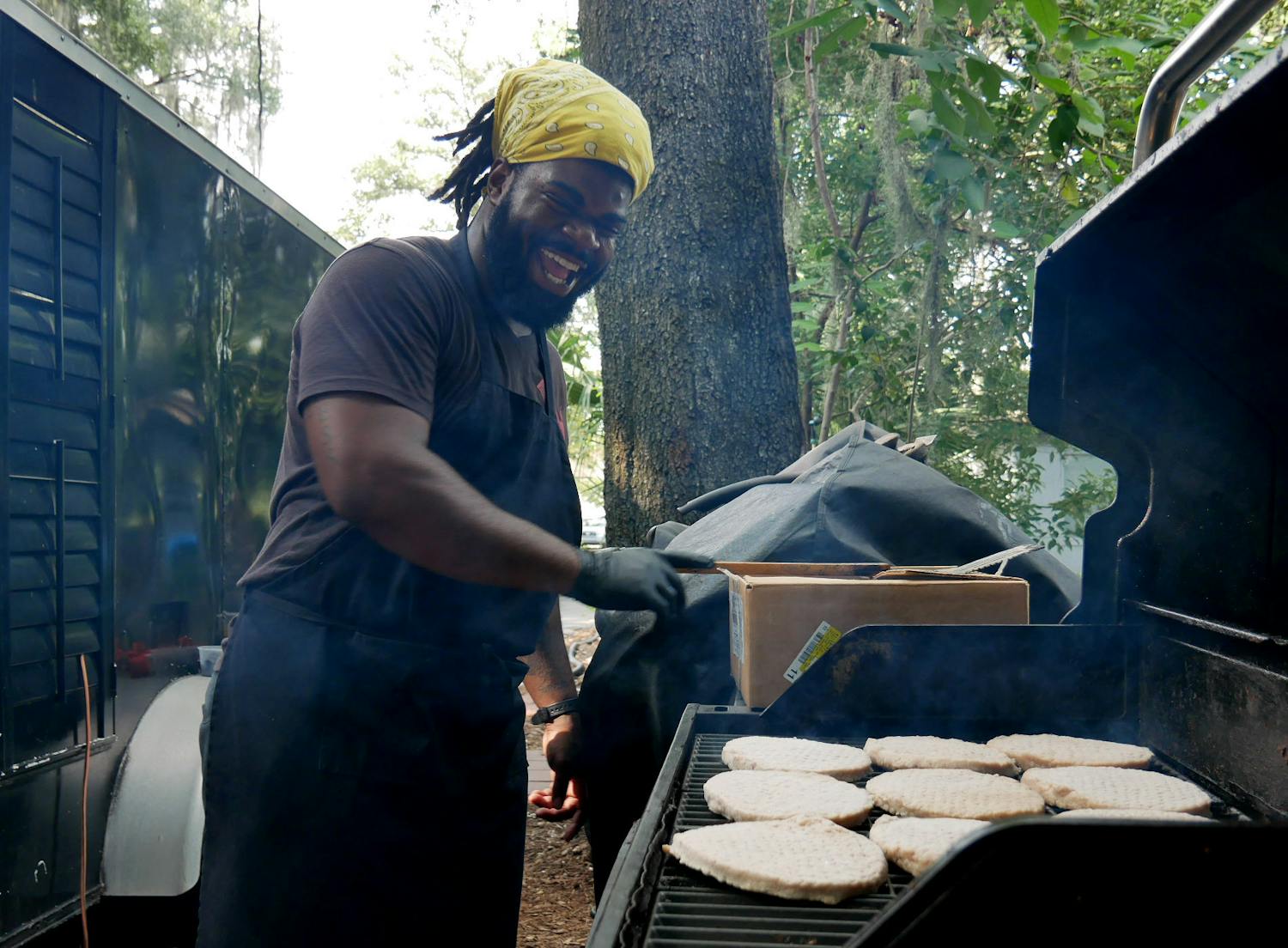 Joshua Joseph, the chef and owner of Tropical Eatz food truck, grills at 1225 NW 10th Ave., on Thursday, Aug. 24, 2023. 