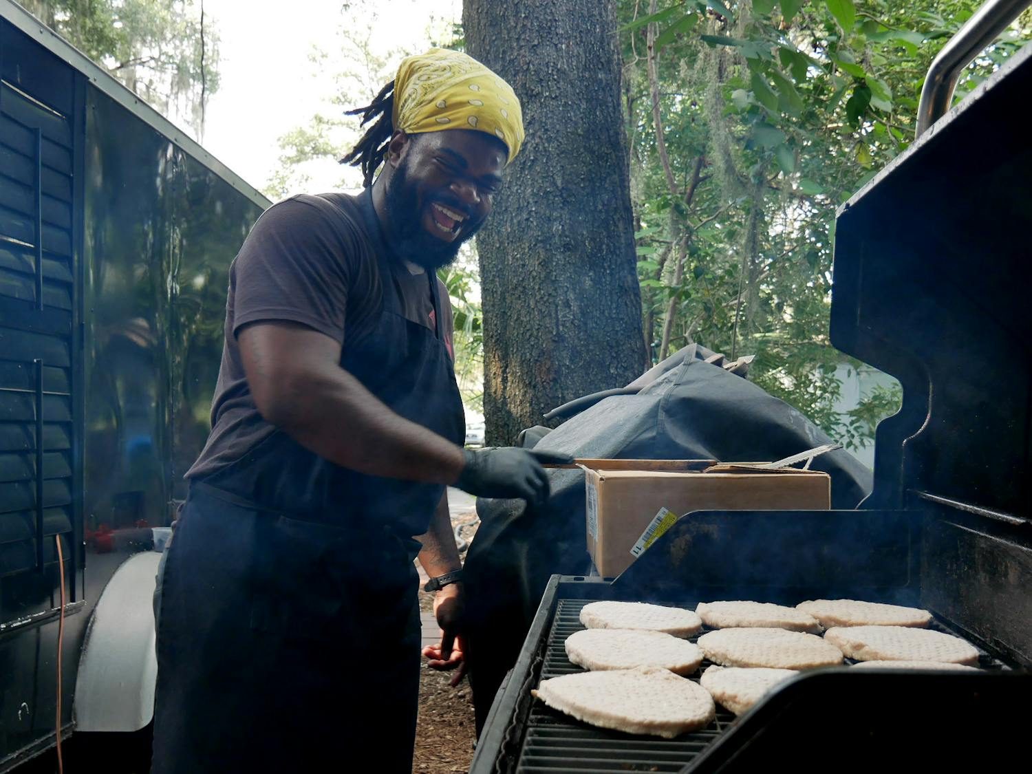 Joshua Joseph, the chef and owner of Tropical Eatz food truck, grills at 1225 NW 10th Ave., on Thursday, Aug. 24, 2023. 