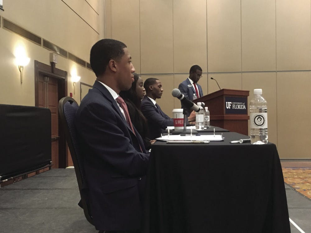 <p dir="ltr"><span>Student Body President candidates Ian Green, Janae Moodie and Revel Lubin answer audience questions at the Black Student Union debate. This is the first time in UF history three black students have run for Student Body president.</span></p>
<p><span>&nbsp;</span></p>