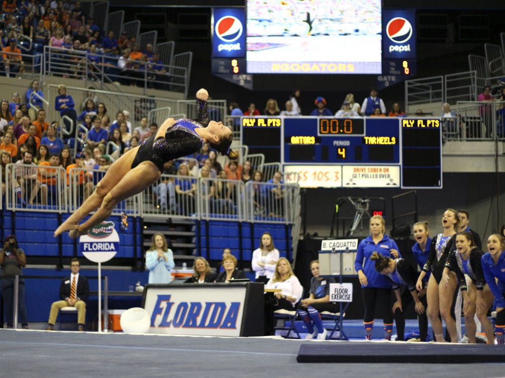 <p>Bridgett Caquatto performs on floor during Florida's win over North Carolina on March 11, 2016, in the O'Connell Center.</p>