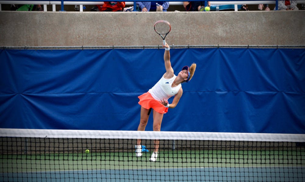 Belinda Woolcock serves during Florida's 4-2 win against Oklahoma State on Feb. 18, 2017, at the Ring Tennis Complex.