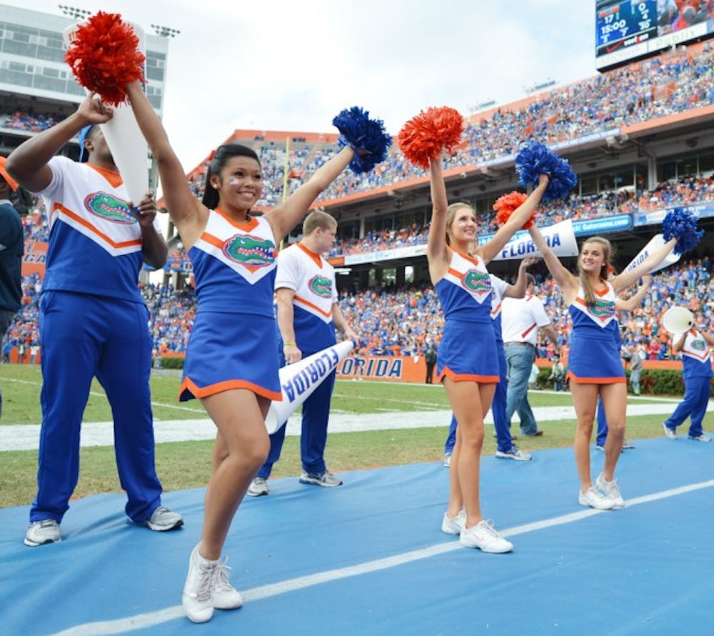 <p>The Gator Cheerleaders pump up the crowd during the football game against Jacksonville State University on Saturday.</p>