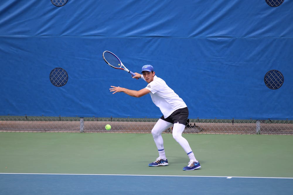 <p>Florida&#x27;s Andy Andrade returns a ball against Auburn February 21. Andrade clinched the winning point to send the Gators to the national championship.</p>