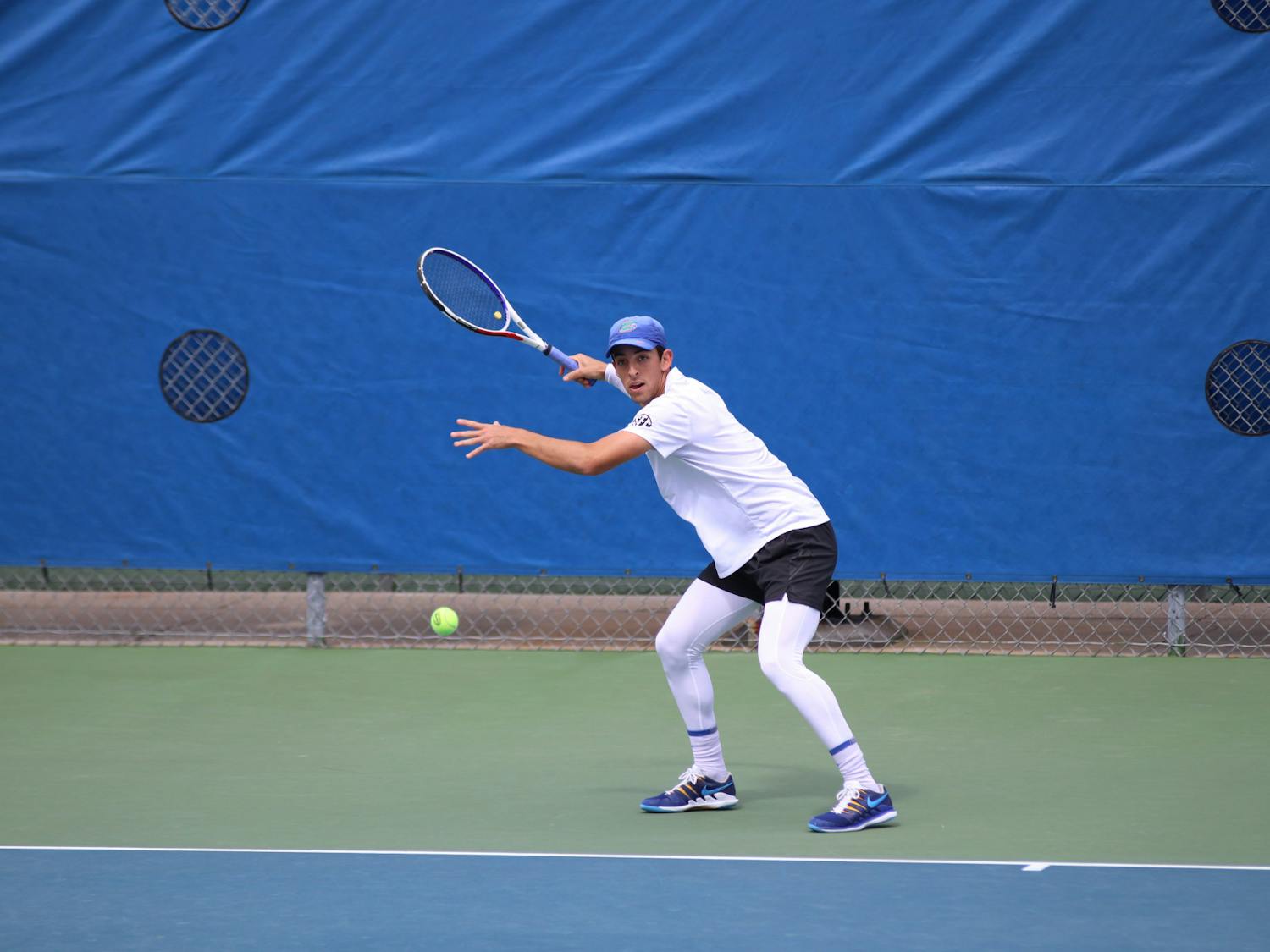 Florida&#x27;s Andy Andrade returns a ball against Auburn February 21. Andrade clinched the winning point to send the Gators to the national championship.