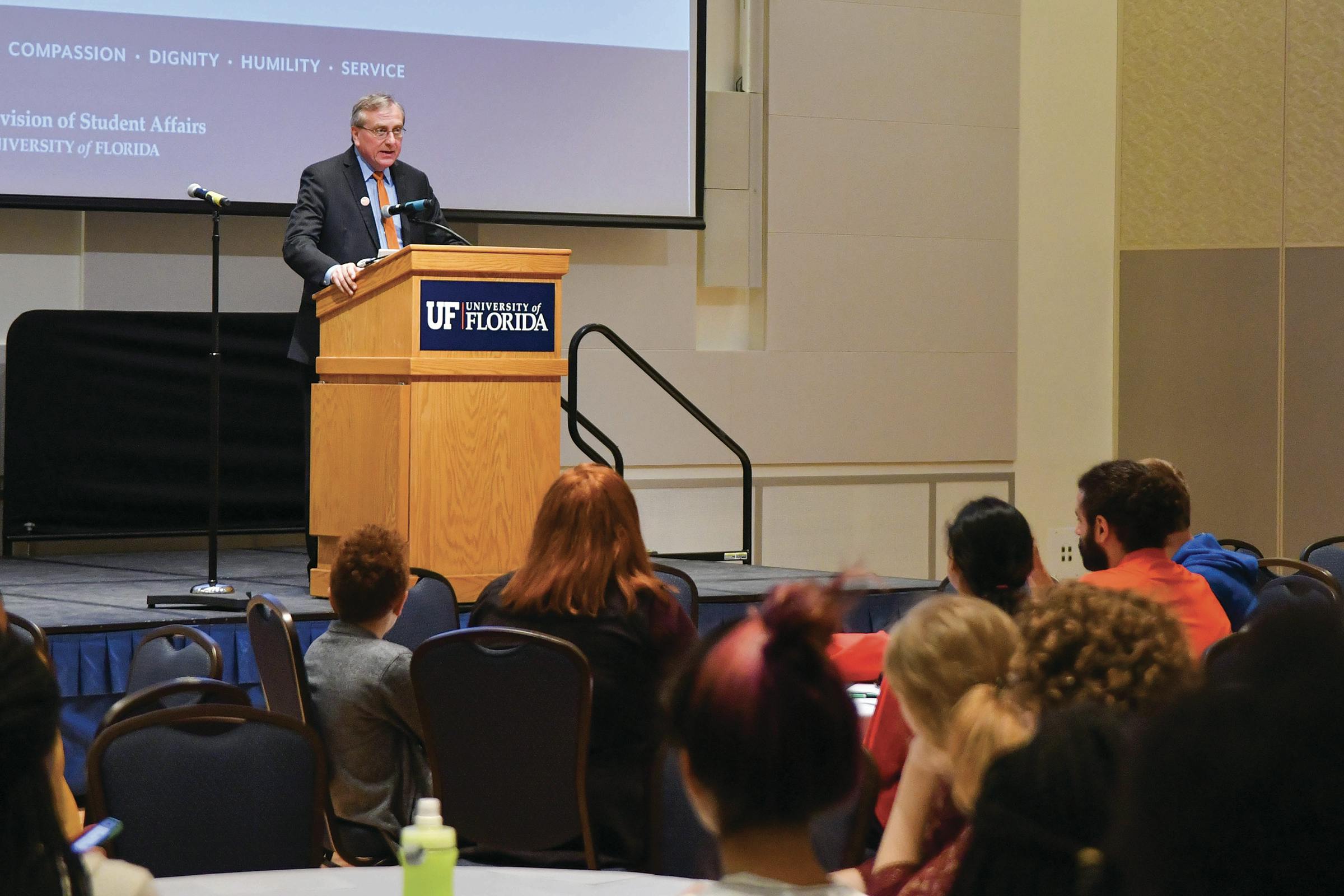 UF President Kent Fuchs addresses a group of students at the Martin King with Malcolm X: Exploring Social Justice through Multiple Lenses opening ceremony on Thursday. The group marched from the Institute of Black Culture to the Reitz Union Rion Ballroom as a part of a candlelight vigil before the ceremony.