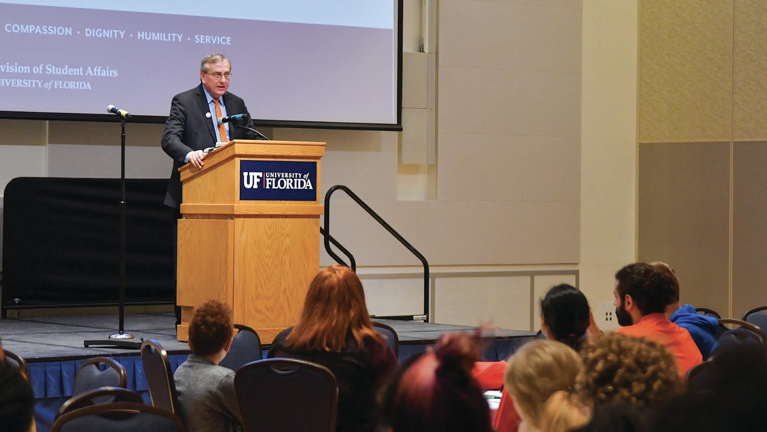 UF President Kent Fuchs addresses a group of students at the Martin King with Malcolm X: Exploring Social Justice through Multiple Lenses opening ceremony on Thursday. The group marched from the Institute of Black Culture to the Reitz Union Rion Ballroom as a part of a candlelight vigil before the ceremony.