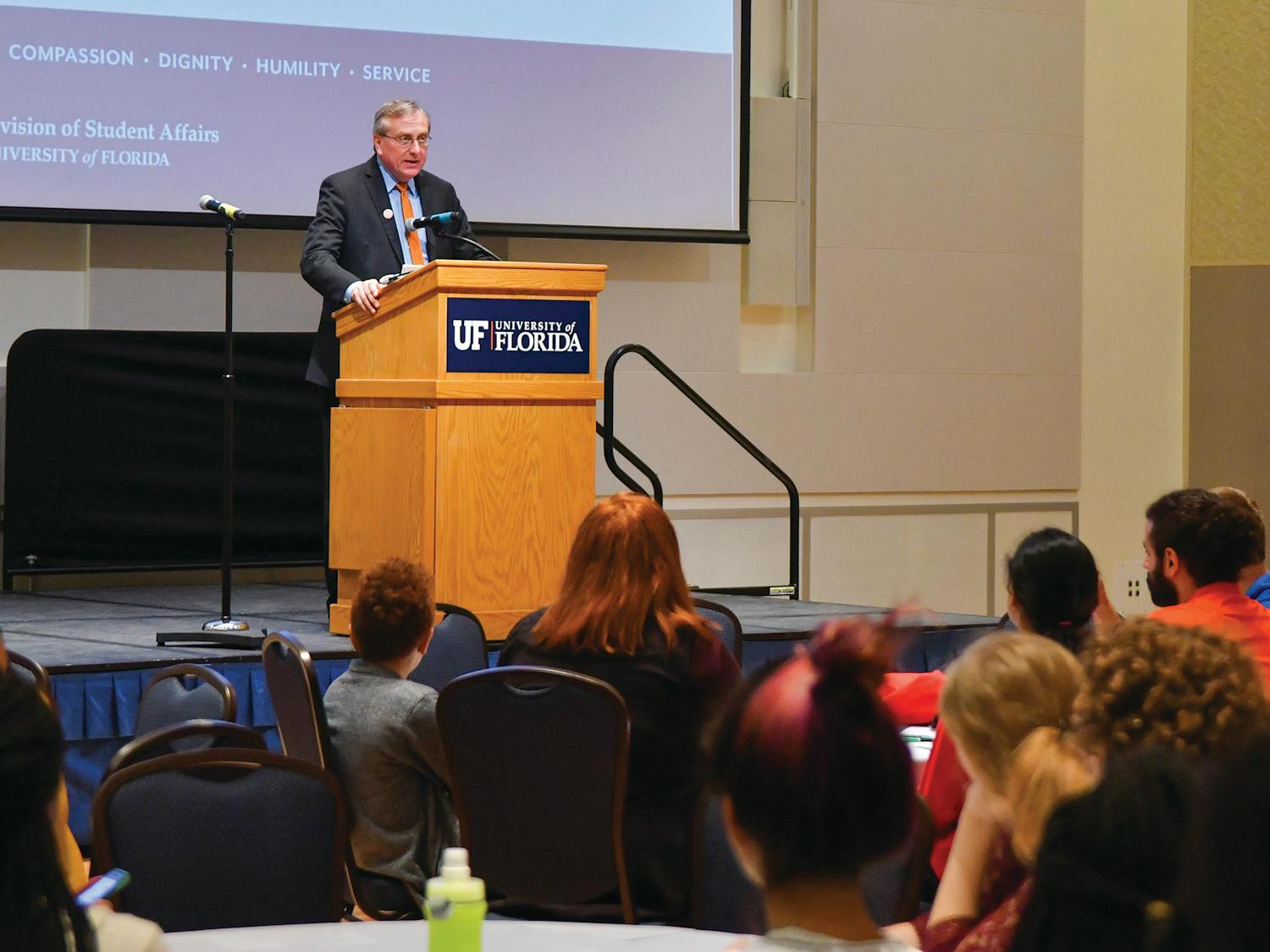 UF President Kent Fuchs addresses a group of students at the Martin King with Malcolm X: Exploring Social Justice through Multiple Lenses opening ceremony on Thursday. The group marched from the Institute of Black Culture to the Reitz Union Rion Ballroom as a part of a candlelight vigil before the ceremony.
