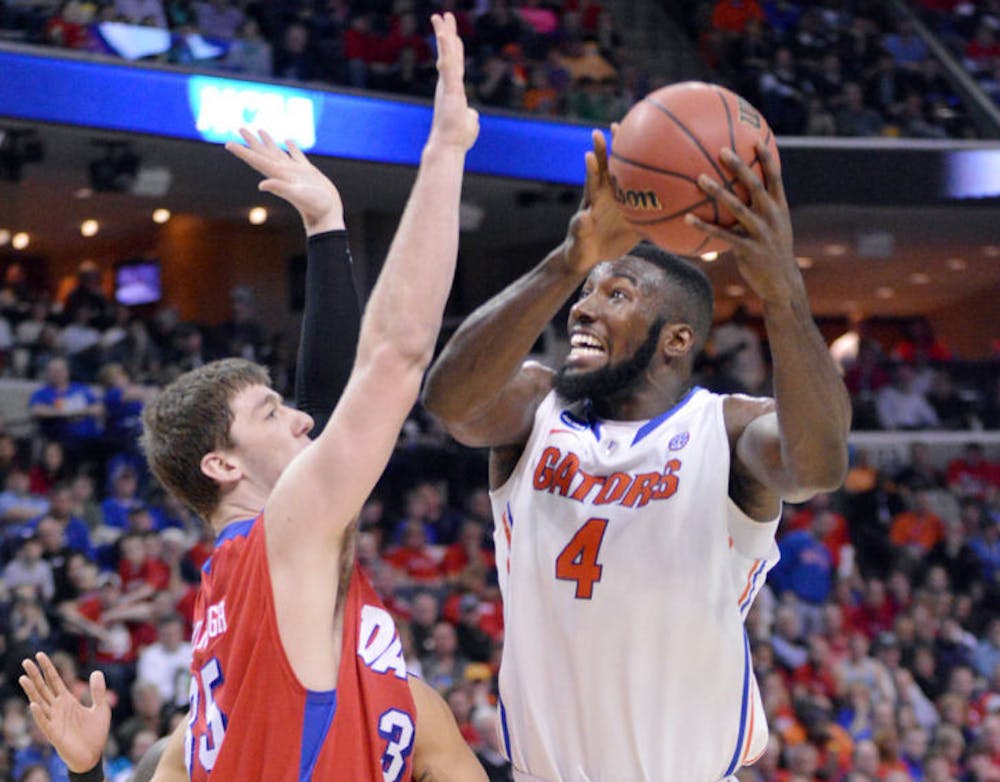 <p align="justify">Patric Young prepares to shoot during Florida’s 62-52 win against Dayton on Saturday in FedExForum in Memphis, Tenn.</p>