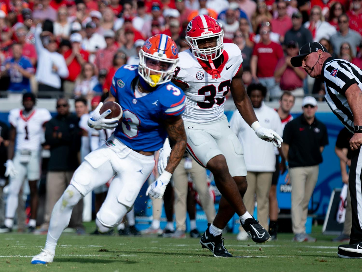 Freshman wide receiver Eugene Wilson III runs with the ball past a Georgia defender in the Gators’ 43-20 loss against the Georgia Bulldogs on Saturday, Oct. 28, 2023.