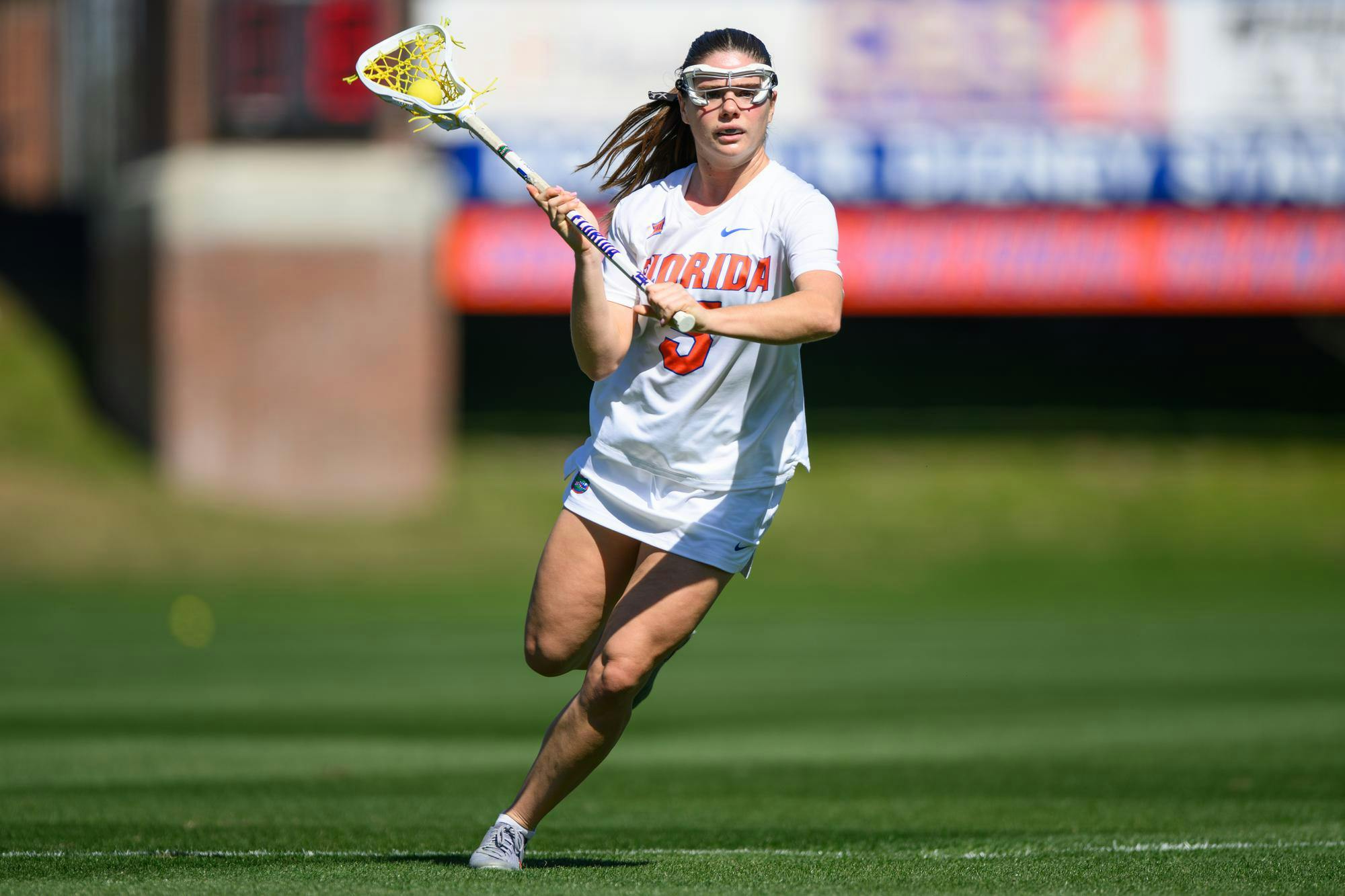 Florida midfielder Kaitlyn Davies (5) runs during the first half of an NCAA lacrosse match against Michigan, Friday, Feb. 13, 2026, in Gainesville, Fla.
