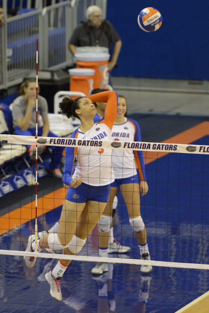 Alex Holston swings at the ball during Florida's 3-0 win against Tennessee on Oct. 27 in the O'Connell Center.