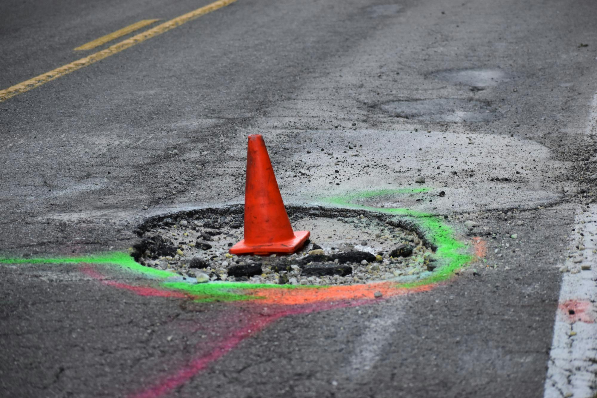 Pothole named "Queen Mary Crater" on CR 346 near River Styx, Friday, Aug 21, 2026, in Gainesville, Fla.