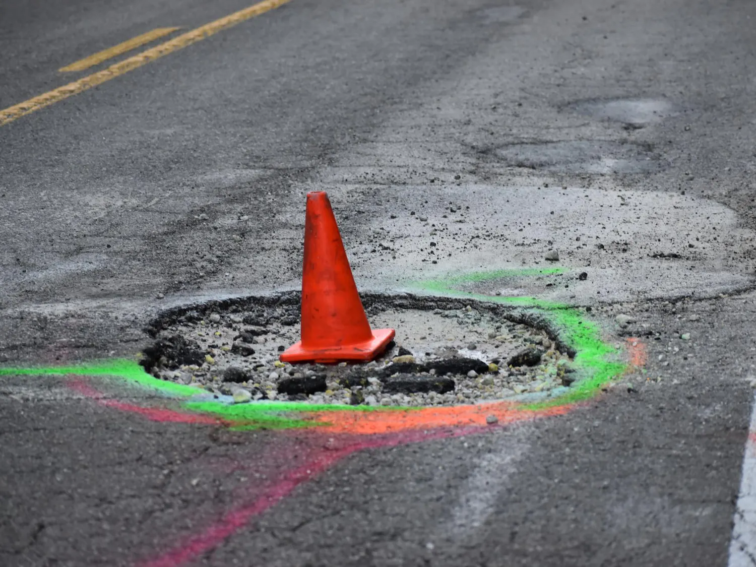 Pothole named "Queen Mary Crater" on CR 346 near River Styx, Friday, Aug 21, 2026, in Gainesville, Fla.