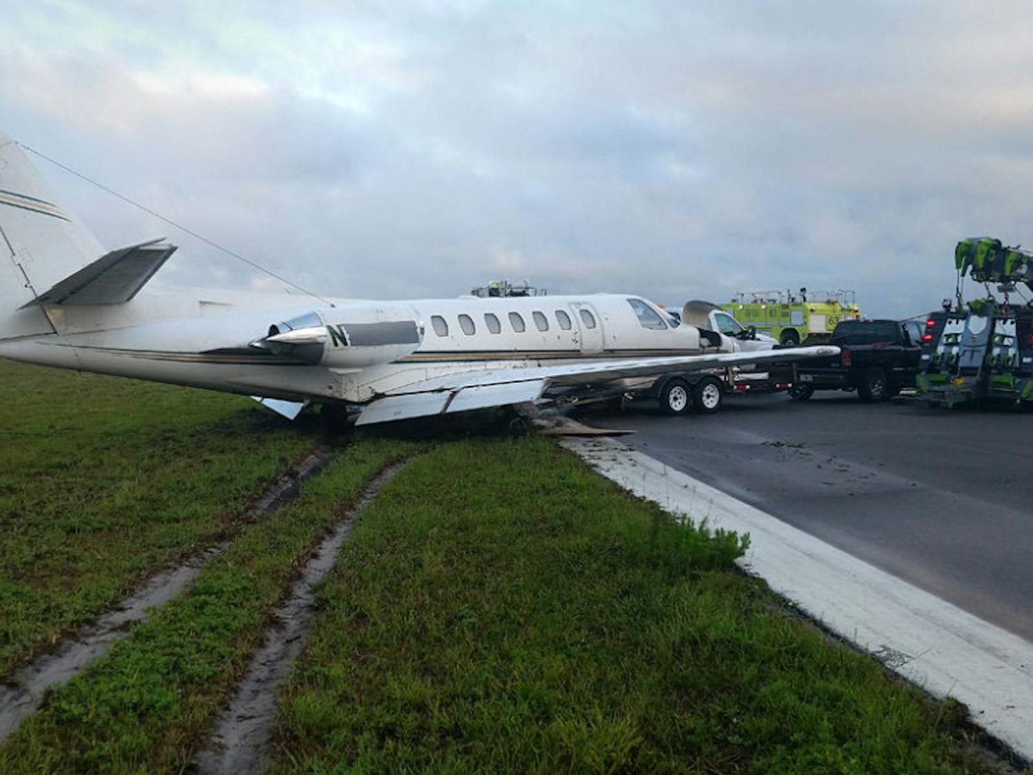 As a result of the inclement weather from Tropical Storm Colin, a twin engine plane with two occupants lies in a ditch off the runway at Gainesville Regional Airport after skidding over 1,000 feet on Monday night, according to a Gainesville Fire Rescue emergency incident report. The pilots on board were unharmed, and the plane was removed from the runway, according to the report.