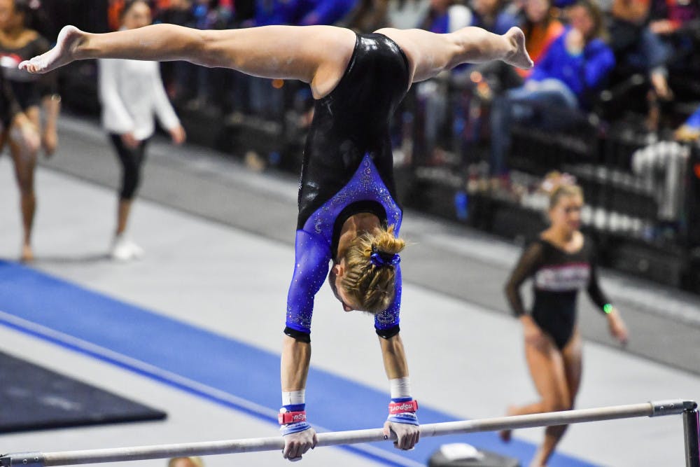<p>Alex Mcmurtry perfroms her bars routine against Georgia on Friday, Feb. 10, 2017. The routine received a perfect 10. </p>