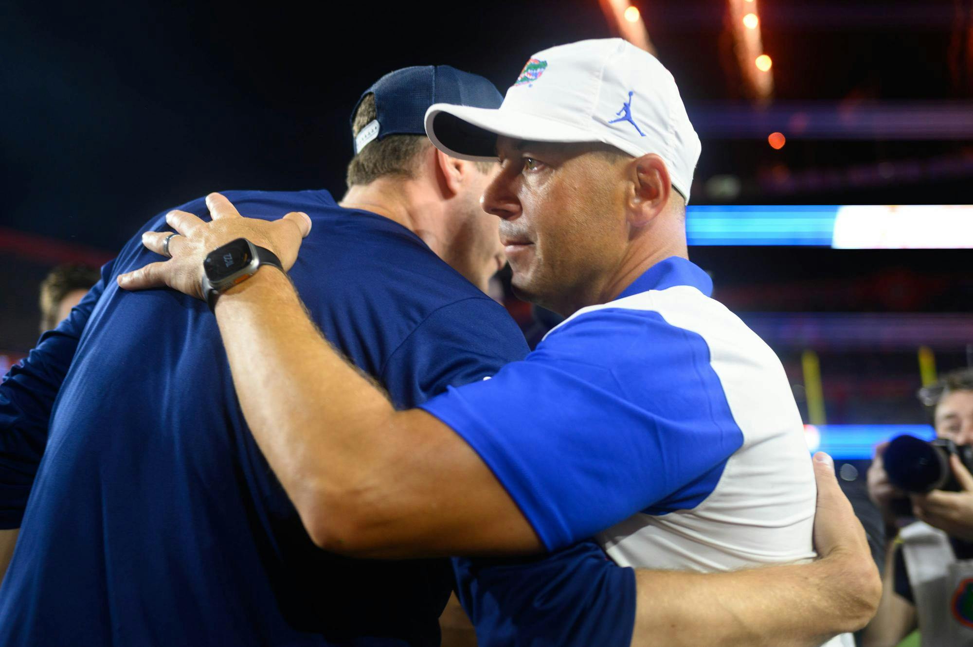 Florida head coach Jon Sumrall hugs FAU head coach Zach Kittley after an NCAA college football game against FAU, Saturday, Sept. 5, 2026, in Gainesville, Fla.