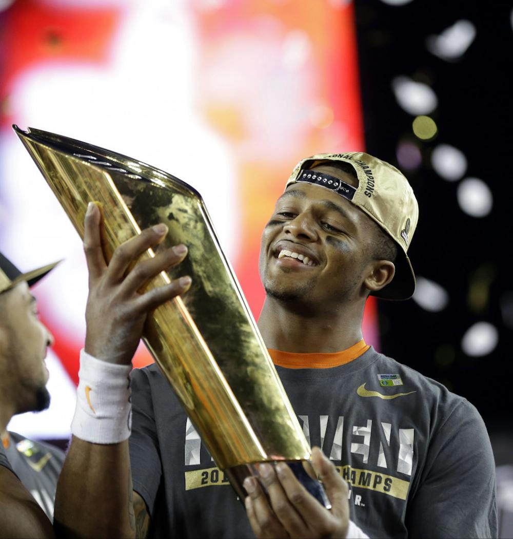<p>Clemson's Deshaun Watson holds up the championship trophy after the NCAA college football playoff championship game against Alabama Tuesday, Jan. 10, 2017, in Tampa, Fla. Clemson won 35-31. (AP Photo/David J. Phillip)</p>