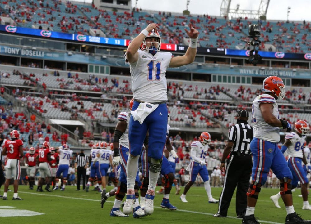 <p>Florida quarterback Kyle Trask hypes up the crowd at TIAA Bank Stadium in Jacksonville, Florida, Saturday. The Gators defeated the Bulldogs in the most recent rivalry game on Nov. 7.</p>