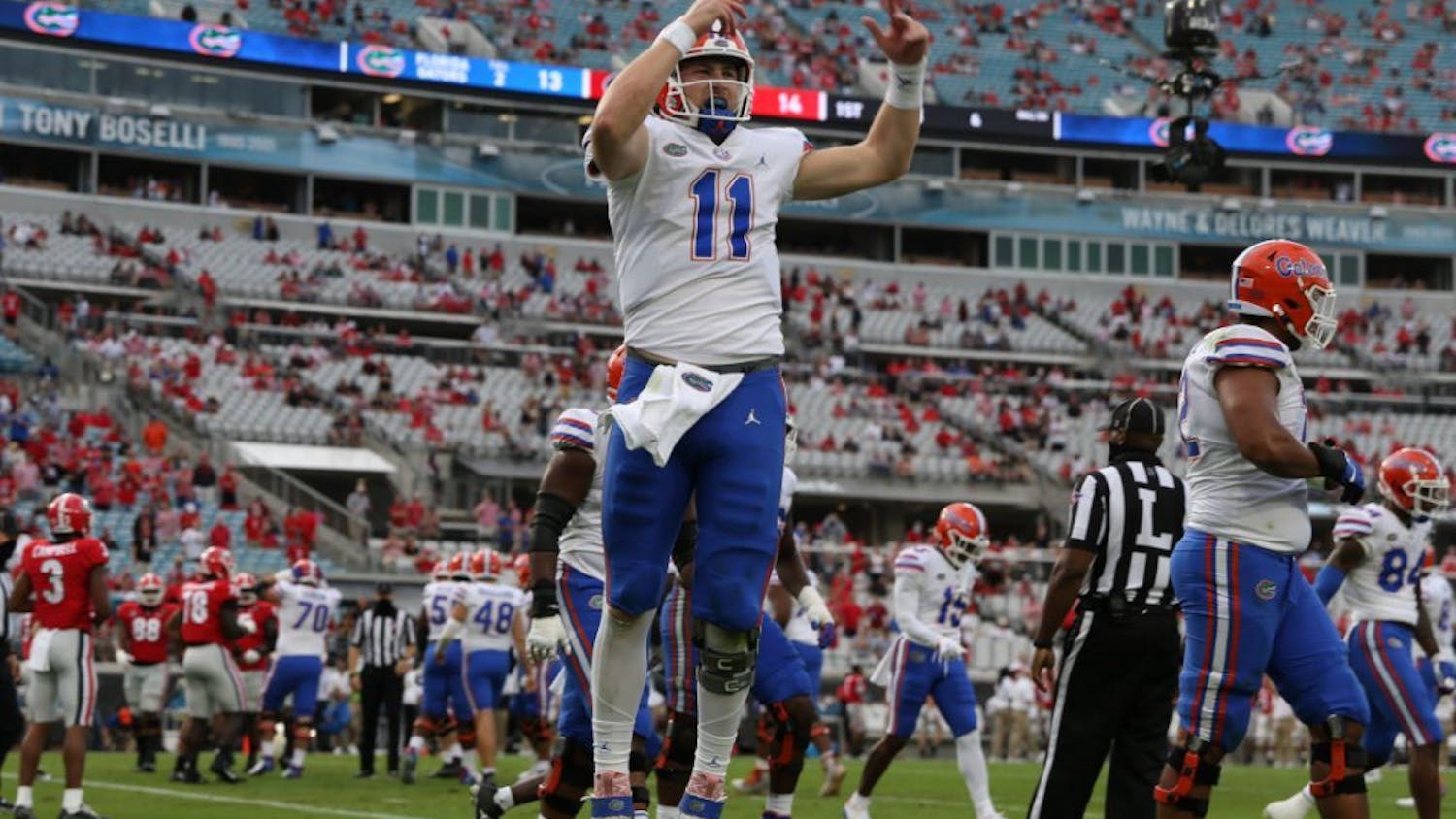 Florida quarterback Kyle Trask hypes up the crowd at TIAA Bank Stadium in Jacksonville, Florida, Saturday. The Gators defeated the Bulldogs in the most recent rivalry game on Nov. 7.