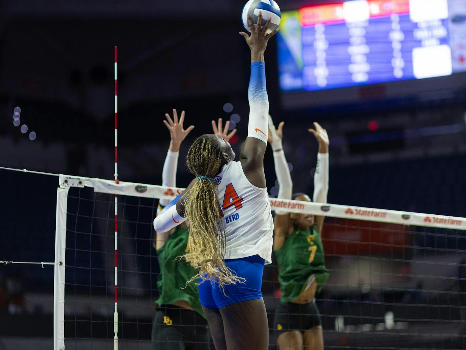 Florida Gators outside hitter Jordyn Byrd (14) pushes the ball over the net during a volleyball match against the Baylor Bears at Exactech Arena at the Stephen C. O'Connell Center on Sunday, September 14, 2024.