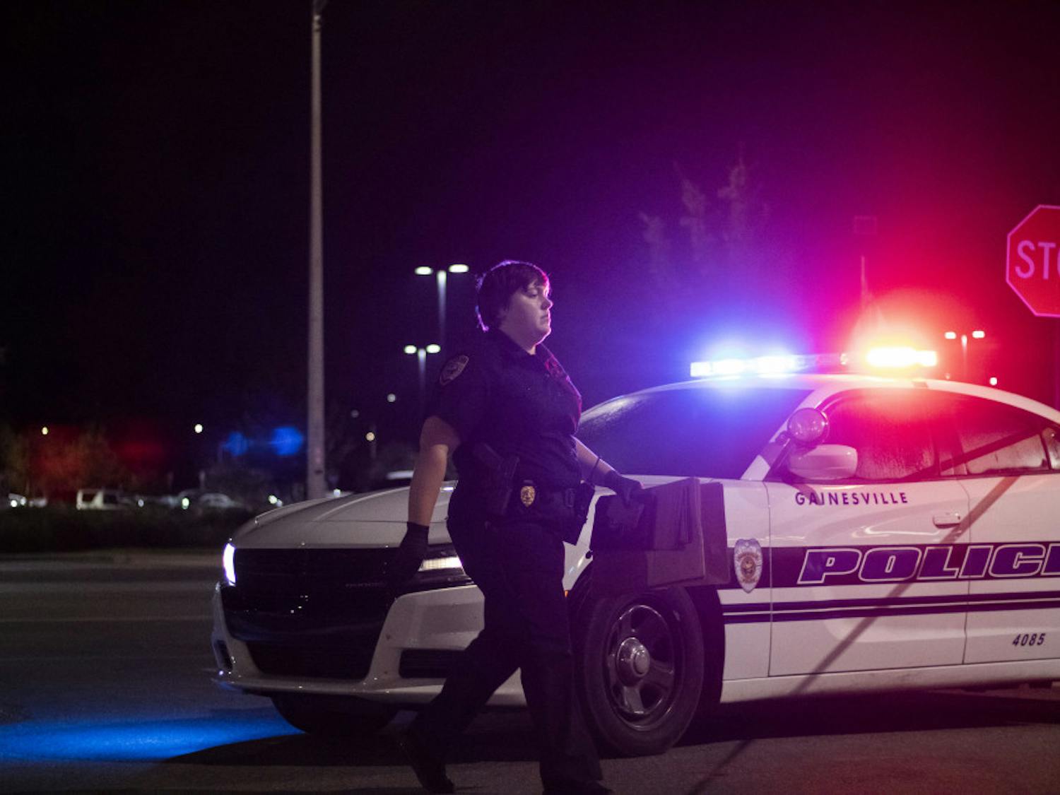 Investigator Boyett approaches the scene Sunday night at the Jersey Mike’s in Butler Plaza.