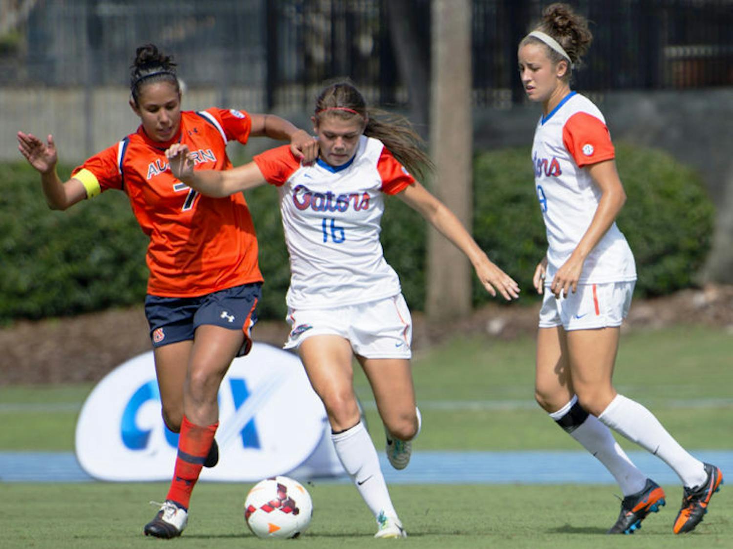 Liz Slattery battles for the ball during Florida’s 3-0 victory against Auburn on Sunday in James G. Pressly Stadium. Slattery recorded her first career assist against the Tigers.
