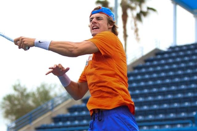 Florida sophomore Nate Bonetto hits the ball in the Gators' 4-3 loss to the Georgia Bulldogs Sunday, April 9, 2023.