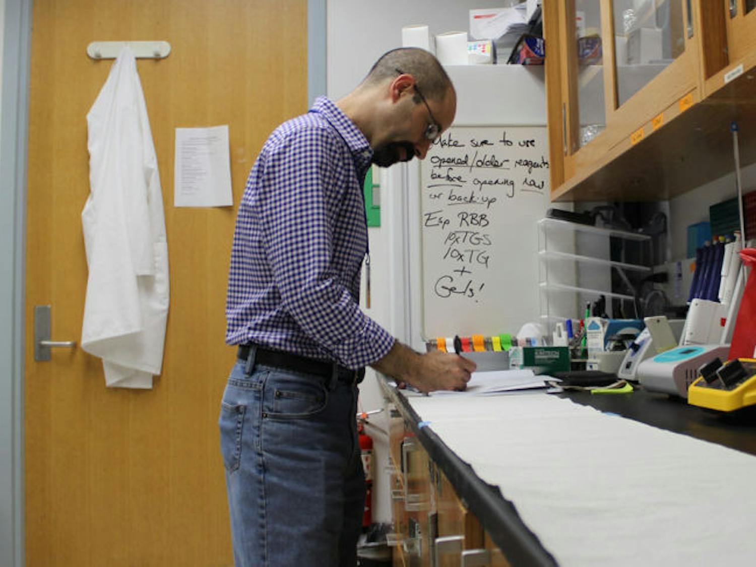 Barry Setlow, an associate professor at the UF College of Medicine, works in his lab at the McKnight Brain Institute. He and a team of researchers are testing a drug therapy that could help with memory loss.