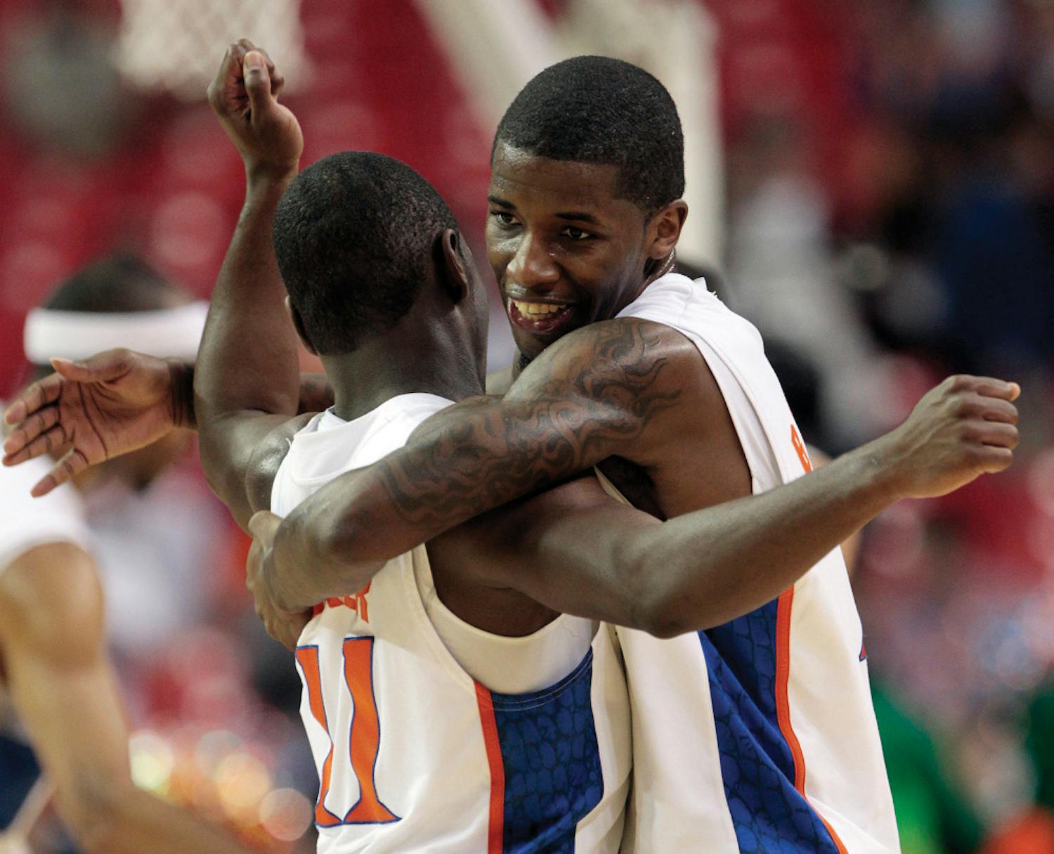 Florida guard Kenny Boynton, right, embraces Florida guard Erving Walker (11) after the Gators defeated Vanderbilt 77-66 in an NCAA college basketball game at the Southeastern Conference tournament, Saturday, March 12, 2011, in Atlanta.