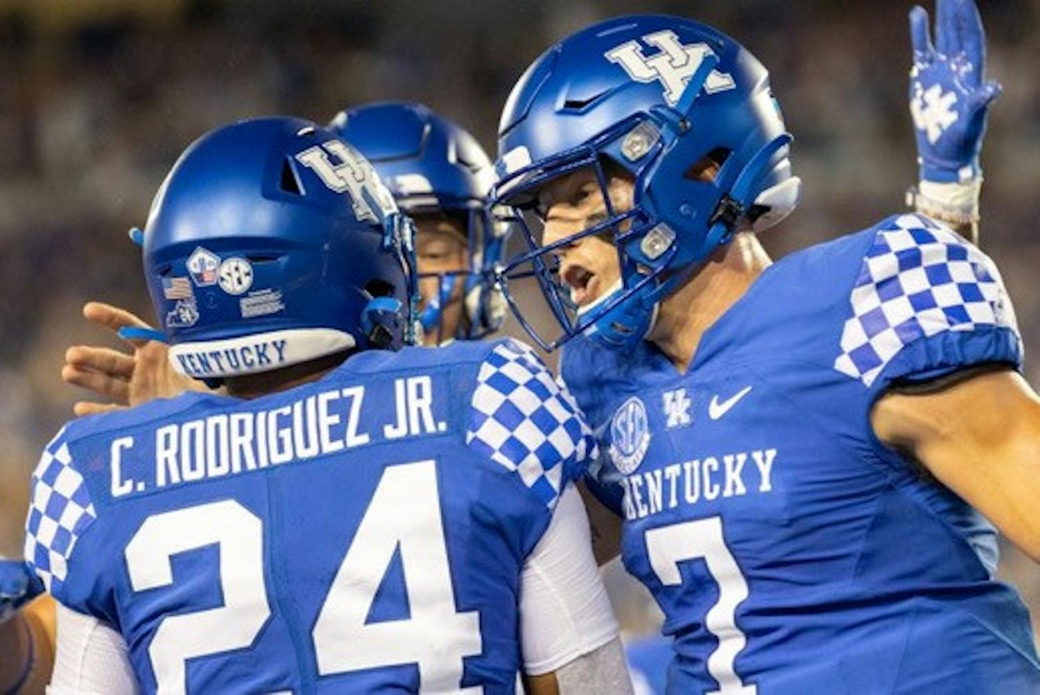 Kentucky quarterback Will Levis (7) and Chris Rodriguez Jr. (24) celebrate together during a game. Photo by Jack Weaver (Kentucky Kernel).