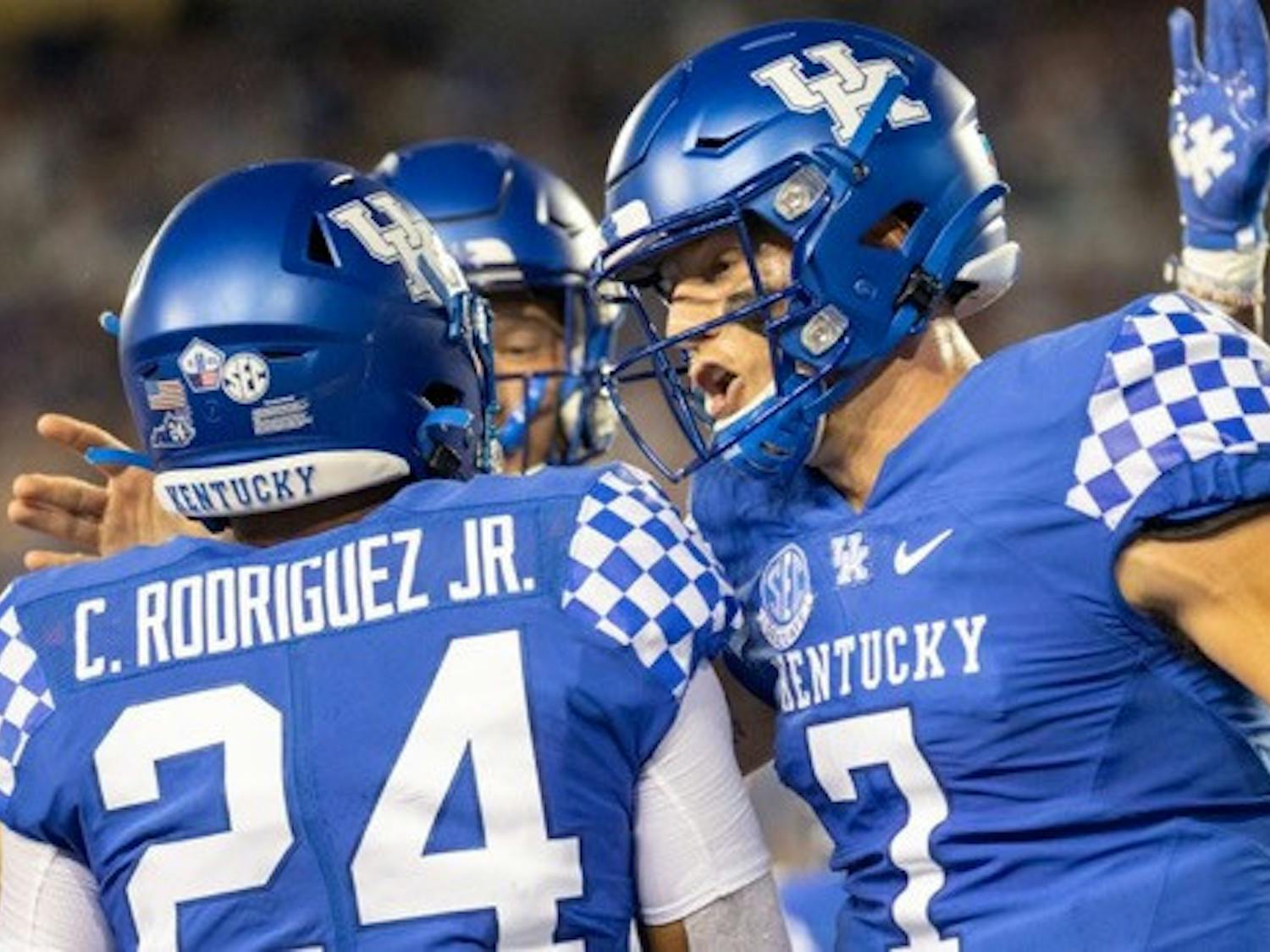 Kentucky quarterback Will Levis (7) and Chris Rodriguez Jr. (24) celebrate together during a game. Photo by Jack Weaver (Kentucky Kernel).