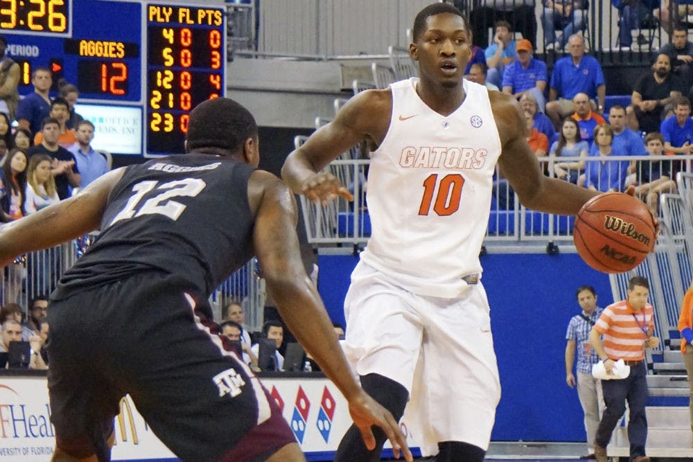 Dorian Finney-Smith looks to pass the ball during Florida's win against Texas A&amp;M on March 3.